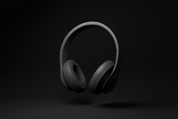 Black headphone floating on black background. minimal concept idea. monochrome. 3d render.