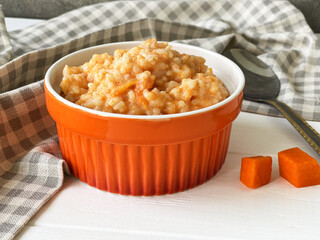 rice porridge with pumpkin on the table