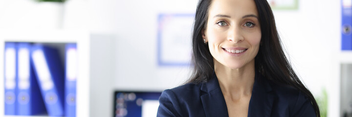 Portrait of smiling businesswoman in her office
