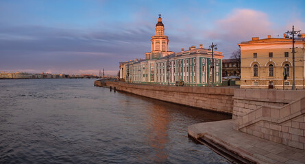 Saint-Petersburg in the white nights. Vasilievsky Island in the early morning. Cities of Russia. Dawn in St. Petersburg. Kunstkamera on the background of a beautiful sky. Petersburg rivers. Neva river