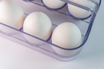 White eggs on the white background