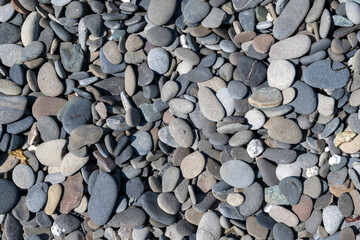 Abstract background-smooth gravel on the beach