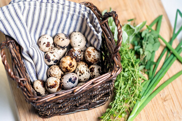 Farm to table home chef quail eggs in basket with herbs for cooking healthy gourmet meals