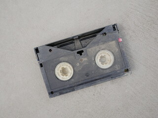 old video tape or vhs tape on the floor.