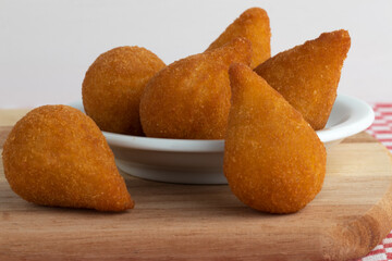 Close up of coxinha of chicken, Brazilian typical snack.