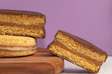 Delicious alfajores stuffed with dulce de leche and covered with chocolate. .