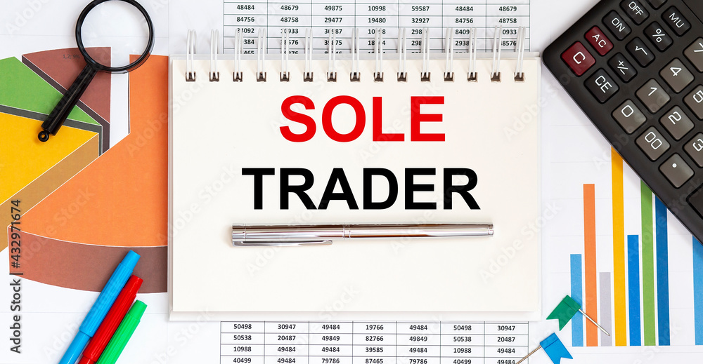 Poster notepad with text sole trader , on the business charts and pen and charts