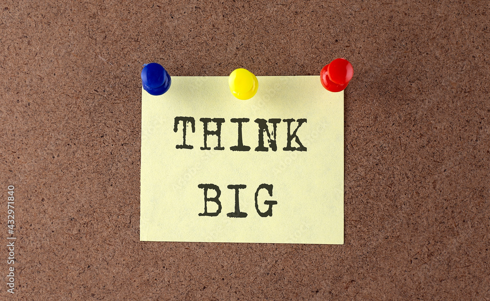 Poster think big text written on the message board. memo