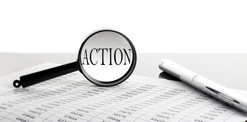 Magnifying glass with text ACTION on the background with pen