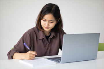 Portrait of beautiful young woman working in the office.
