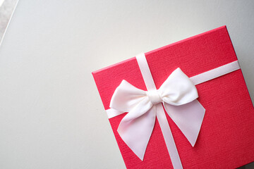 Valentine present. Gift box and red ribbon for romantic couple.Gift box and ribbon with tag for valentine present