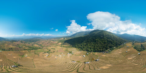360 panorama by 180 degrees angle seamless panorama of aerial view of dry paddy rice terraces,...