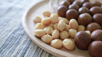 Organic Macadamia nut. macadamia nuts are cracked and baked to taste extremely delicious superfood fresh natural shelled unsalted raw macadamia and healthy food concept