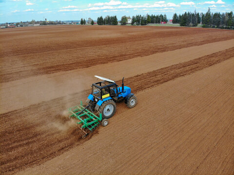Aerial view of a tractor plowing a field