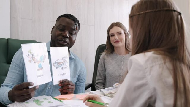 Africanm american man and female teacher teaching English on private lesson