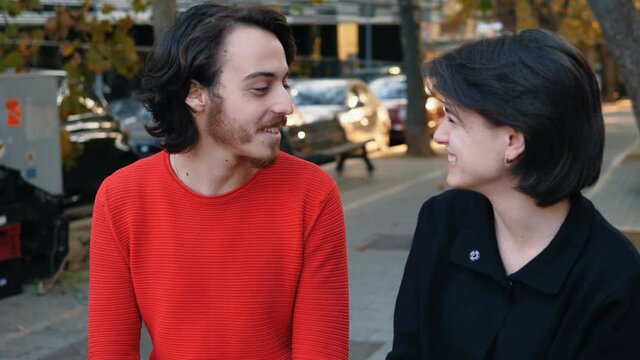 bad breath - smiling girl talking to friend disgusted because of his breath