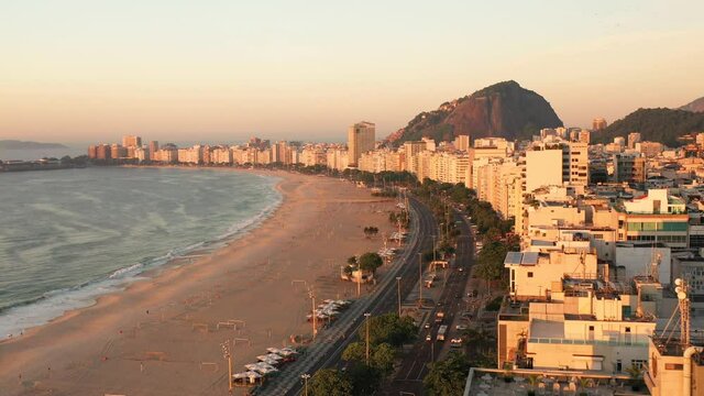 Aerial View Of Copacabana Beachfront And Rio De Janeiro Mountain Skyline, Sunrise