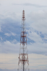 The communication tower behind it is cloudy.