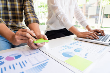 business man financial inspector and secretary making report and brainstorming with colleague in a modern co-working space