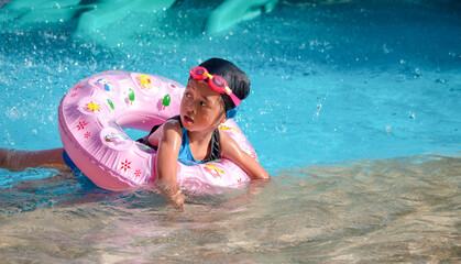 Children frolic at the water park. It is a sunny, perfect day for getting wet and playing hard