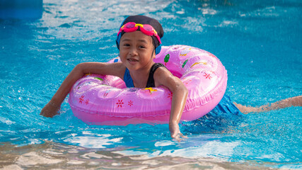 Children frolic at the water park. It is a sunny, perfect day for getting wet and playing hard