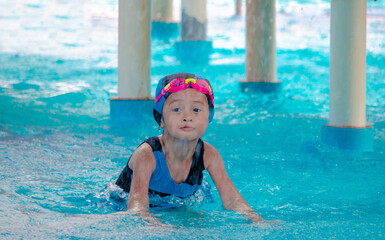 Children frolic at the water park. It is a sunny, perfect day for getting wet and playing hard