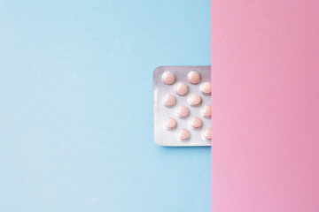Medicine and pills. Plate with tablets on a pink blue background.
