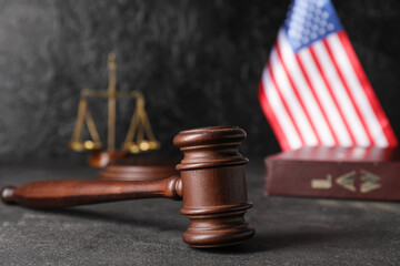 Judge's gavel and USA flag on dark background
