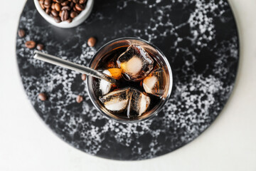 Board with cold brew on light background