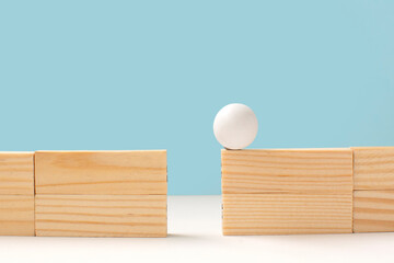 Wooden ball on high wall and needs to be passed to the other side over a gap .Problem solving and...