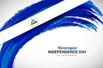 Happy independence day of Nicaragua with watercolor brush stroke flag background with abstract watercolor grunge brush flag