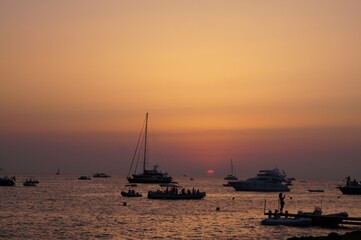 a beach on the island of Ibiza with boats at dusk on a summer night. Balearic Islands, Spain


