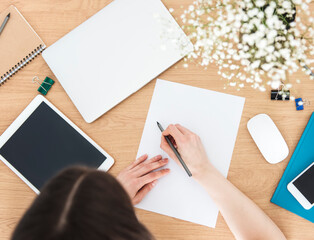 Obraz premium Young girl working at home office