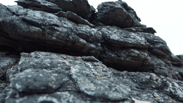 Mountain Stones Standing On Each Other, Close-up. The Structure and Texture of the Stone Rock Consisting of Ancient Layers