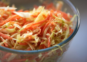 salad in a plate of cabbage and carrots delicious very