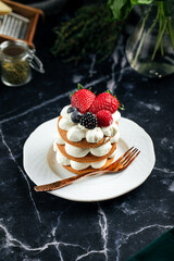 Gingerbread cake on a plate next to a cup of coffee