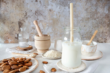 Close-up of homemade almond milk with an ecological bamboo straw
