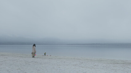 Fototapeta na wymiar Woman and the Landscape of Osorezan in Japan 