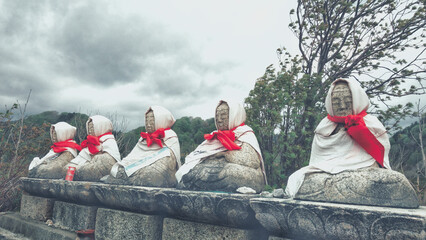 a guardian deity for the spirits of aborted children in Osorezan, Japan.