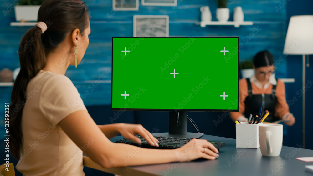 Poster woman looking at computer with green screen mock up chroma key display working at business commerce,