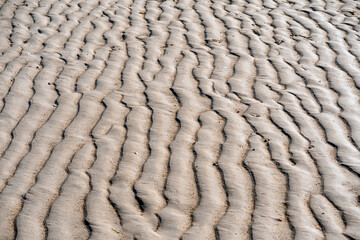 Sand texture surface with defined highlight and shadow. Warm color. Tropical beach concept. Ocean coast.