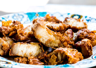 Fried fritter pork belly in  plate , in door  Chiangmai  Thailand