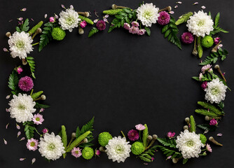 Frame made of colorful flowers chrysanthemum isolated on black background. Flowers composition. Summer wreath of chrysanthemum flowers.
