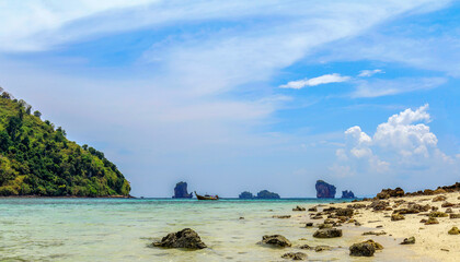 Fototapeta na wymiar Stone and sea wave on foreground at beach of Phang-nga bay national park southern of Thailand