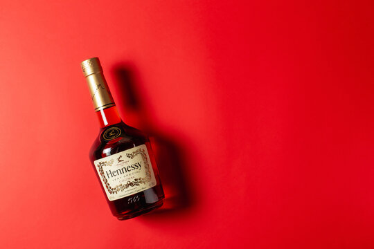 Ternopil, Ukraine - April 29, 2021: A bottle of Hennessy very special cognac on red background. Copy space