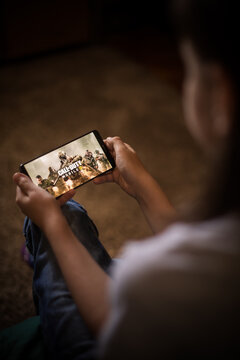 Illustrative editorial image of child playing Call of Duty mobile
