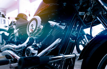 Selective focus on a motorcycle engine. Closeup motorcycle exhaust pipe, engine guard, air filter,...