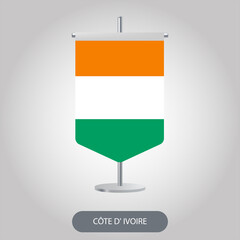 Ivory Coast vertical desk flag on light grey background. Côte d'Ivoire vertical table flag on grey background.