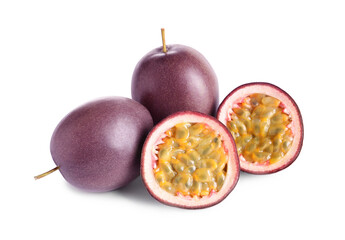 Cut and whole passion fruits on white background