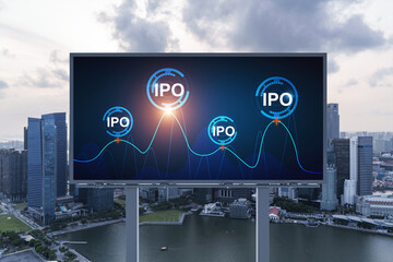 IPO icon hologram on road billboard over sunset panorama city view of Singapore. The hub of initial...